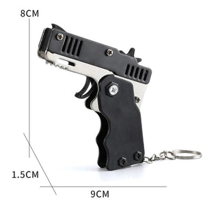 Planet Gates 1pcs Mini Metal Gun Folding Rubber Band Toy Outdoor Sports Keychain Toy 6 Bursts Rubber Pistol Kids Gifts Party Favor Gun Toys