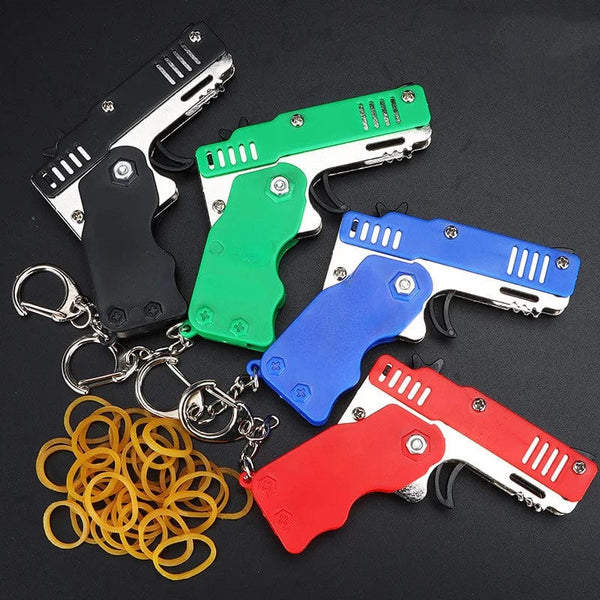 Planet Gates 1pcs Mini Metal Gun Folding Rubber Band Toy Outdoor Sports Keychain Toy 6 Bursts Rubber Pistol Kids Gifts Party Favor Gun Toys