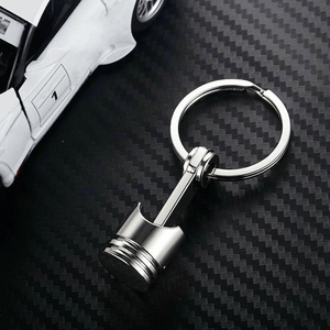 Planet Gates Metallic Luster Creative Metal Piston Model Keyring: A Stylish Keychain for Car Enthusiasts!