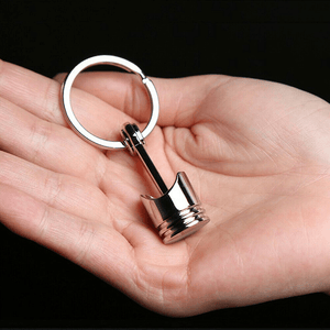 Planet Gates Metallic Luster Creative Metal Piston Model Keyring: A Stylish Keychain for Car Enthusiasts!