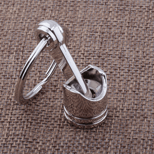 Planet Gates Metallic Luster Creative Metal Piston Model Keyring: A Stylish Keychain for Car Enthusiasts!